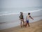 Indian fishermen carrying freshly catch fish at Malvan beach at morning