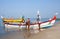 Indian fishermen catching fish for food in wooden boats