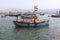 Indian fishermen and tricolor with his boat, Harne bandar, Fatehgad, Kokan