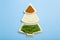 Indian flag in the shape of a new year christmas tree made from food background. Basmati rice, curry, green peas and