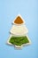 Indian flag in the shape of a new year christmas tree made from food background. Basmati rice, curry, green peas and