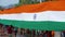 Indian Flag Tiranga means Tricolor, unfurl during biggest religious festival of India Kumbh Mela. 60fps Apple prores 422