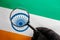 The Indian flag is visible through a magnifying glass. Spies and Observations for India India. Monitoring the state of India