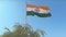 Indian flag waving triumphantly in clear summer sky, symbolizing independence generated by AI