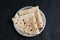 Indian flat bread Chapati, roti made of whole wheat flour and baked black background