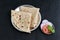 Indian flat bread Chapati, roti made of whole wheat flour and baked black background
