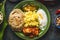 Indian food bowl with curry, yogurt ,rice,bread , chicken,chutney and spices