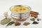 Indian Food- Kadhi with gatte in stainless steel pot with spices.