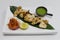 indian food speciality tandoori malai chicken tikka, cream based marinated chicken cubes cooked in clay oven