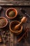 Indian Garam masala powder with ingridients on wooden background