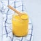 Indian ghee clarified butter with wooden spoon