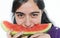 Indian girl eating watermelon fruit.