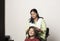 An indian girl getting her head massage by her mother, daughter and mother love for mother`s day concept