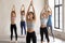 Indian girl and a group practicing yoga, Tadasana pose