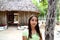 Indian girl in jungle palapa hut house rainforest