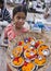 Indian girl selling offerings - Varanasi - India