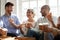 Indian girl spend time friends eating pizza and chatting indoors