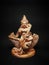 Indian Godess Saraswati statue with dark background and selctive focus.