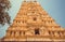 Indian gopuram - tower of tample gate. Traditional Hindu art with reliefs and sculptures in India