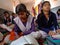 indian government school female students writing on notebook into the classroom in india January 2020