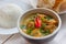 Indian green curry with basmati rice and papadums