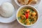 Indian green curry with basmati rice and papadums