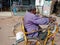 an indian handicapped man riding hand wheel bicycle on road in India January 2020