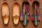 Indian handmade Punjabi Jutti and Kolhapuri Chappal - colorful womens ethnic footwear at local market in Jaisalmer, Rajasthan,