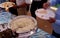 Indian Hindu volunteer serve the fried rice to the devotee, in free distribution of prasad or food or meal in a temple