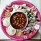 Indian homemade steam, dry idlis, chole masala, biscuits breakfast