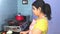 Indian housewife in kitchen
