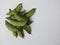 Indian Hyacinth Beans or Avarekai with and without peeled seeds  on white background