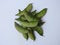 Indian Hyacinth Beans or Avarekai with and without peeled seeds  on white background