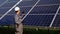 Indian Inspector Engineer Holding Digital Tablet Working in Solar Panels Power Farm