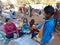 an indian kid buying toys at street shop at fair in India January 2020