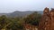 Indian king fort covered  by mountains and green forest.