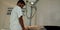 an indian lab technician operating X-ray machine to the patient leg at hospital in india oct 2019