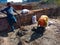 an indian labour girl pulling up cement material for home construction in india dec 2019