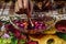 A indian lady lit up a jar is which is loaded with rose and candle on indian festival diwali deepawali with fire  on table