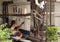 Indian lady sat a loom making cotton carpets by hand outdoors