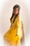 Indian lady in yellow sari