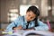 Indian little girl studying at home