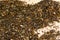 Indian loose Darjeeling black tea on jute burlap background, close up