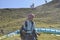 A Indian male tourist ready to paragliding flight with professional paraglider.