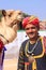 Indian man with a camel taking part in Desert Festival, Jaisalmer, India