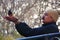 Indian man feeding Rufous treepie from his hands, Ranthambore Na