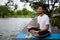 Indian man hand yoga with rock