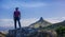 Indian man hiking and posing in front of Lions Head Mountain.