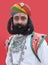 Indian man with long mustaches poses for a photo during Camel Festival in Rajasthan, India