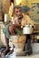 Indian man preparing masala chai